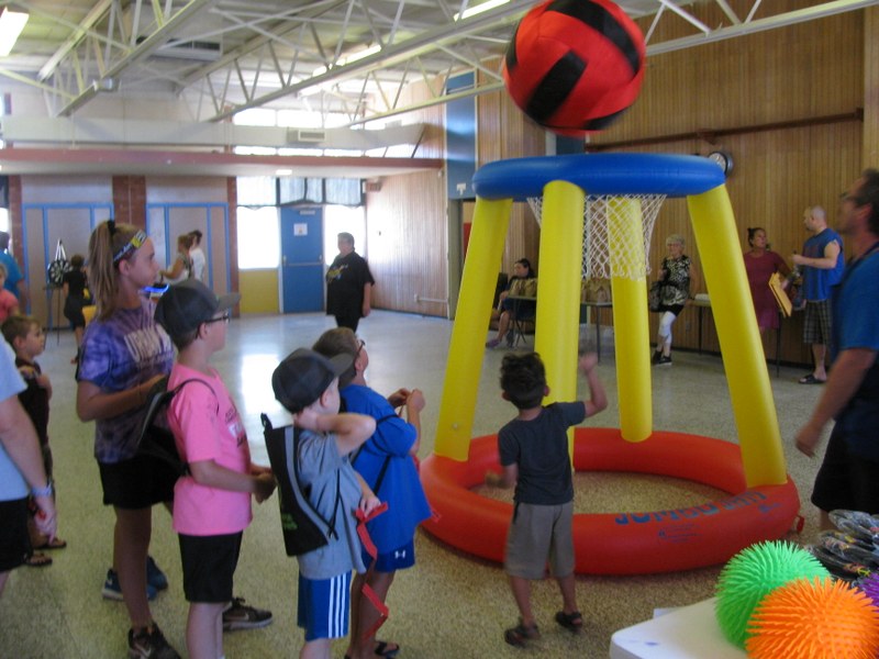 If you look through the basketball goal you can see Mrs. Sharon at the snack station.  She is multi talented as the Friends President