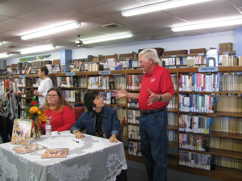 I'm not sure if Mr. Palmer is sharing a fishing story or what but Mrs. Blackwell is very interested.