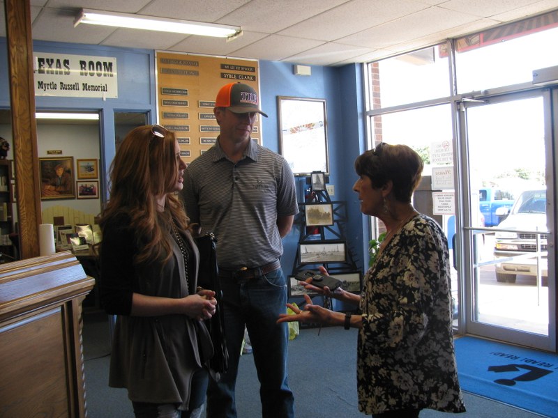 Jodi Blackwell West and her husband catching up with Mary Laura Slappey.JPG